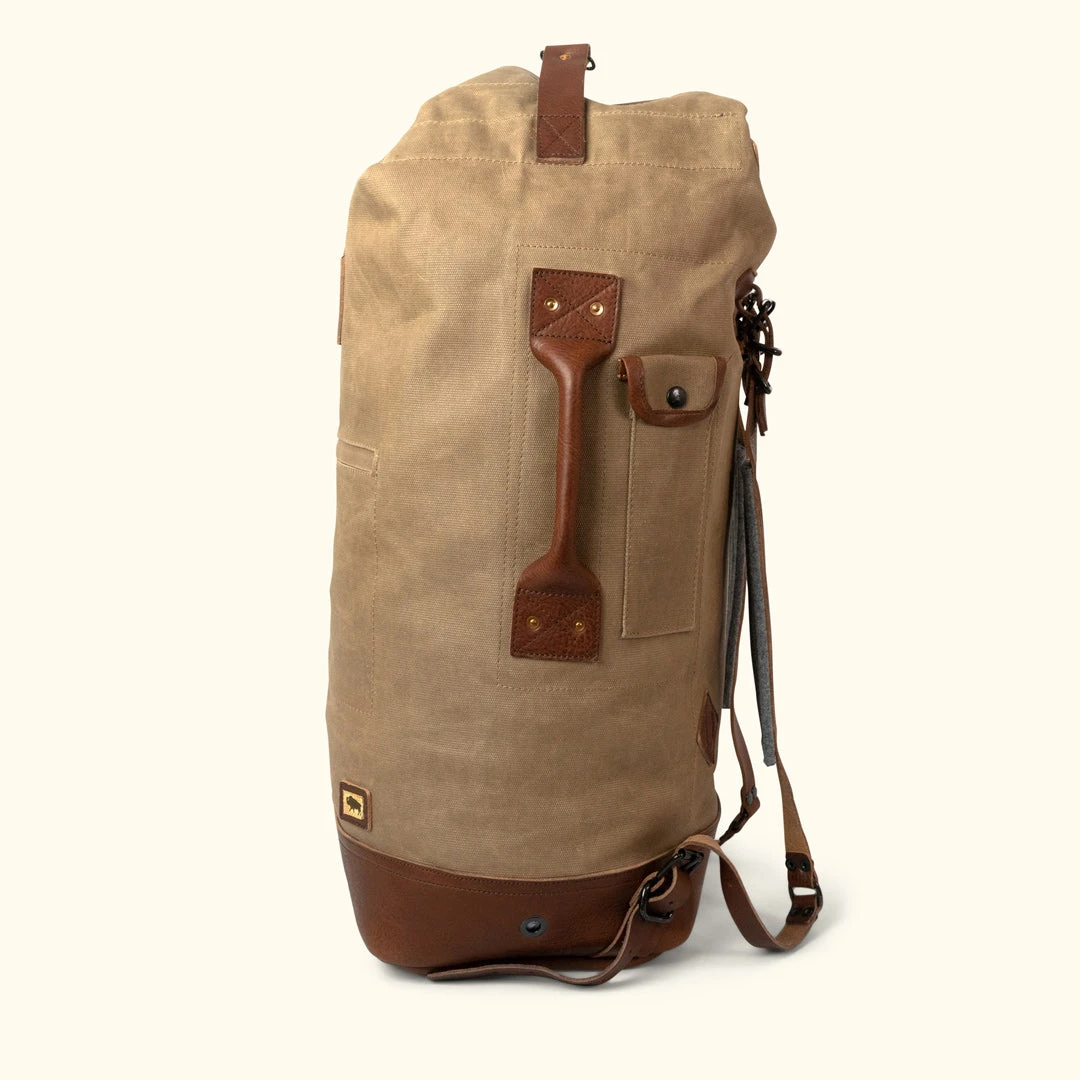 Buffalo Jackson Trading Co. Dakota Waxed Canvas Military Sea Bag Backpack | Field Khaki W/ Chestnut Brown Leather