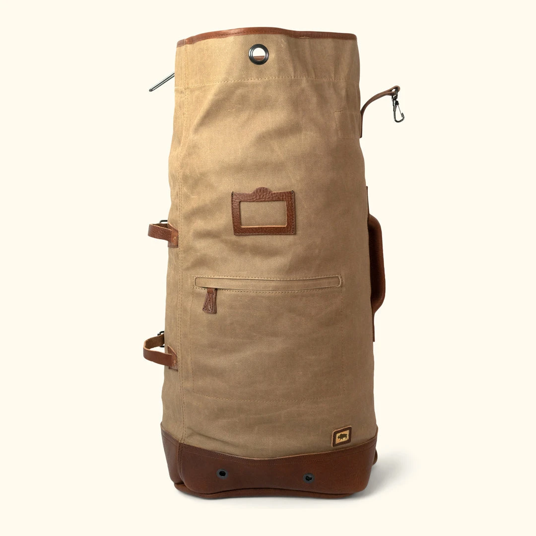 Buffalo Jackson Trading Co. Dakota Waxed Canvas Military Sea Bag Backpack | Field Khaki W/ Chestnut Brown Leather