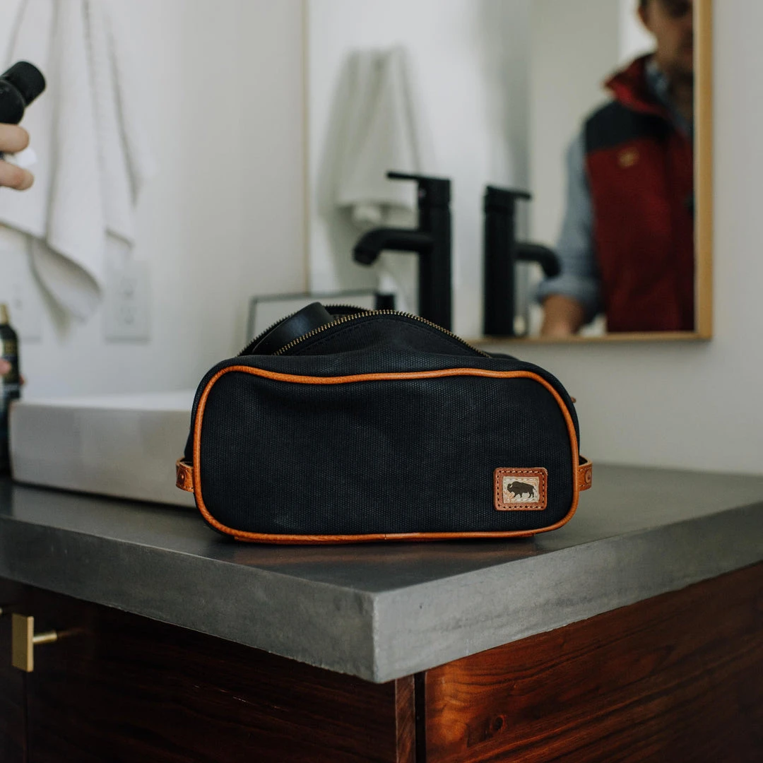 Buffalo Jackson Trading Co. Dakota Waxed Canvas Dopp Kit Toiletry Bag | Navy Charcoal W/ Saddle Tan Leather 7 Buffalo Jackson Trading Co. Dakota Waxed Canvas Dopp Kit Toiletry Bag | Navy Charcoal W/ Saddle Tan Leather