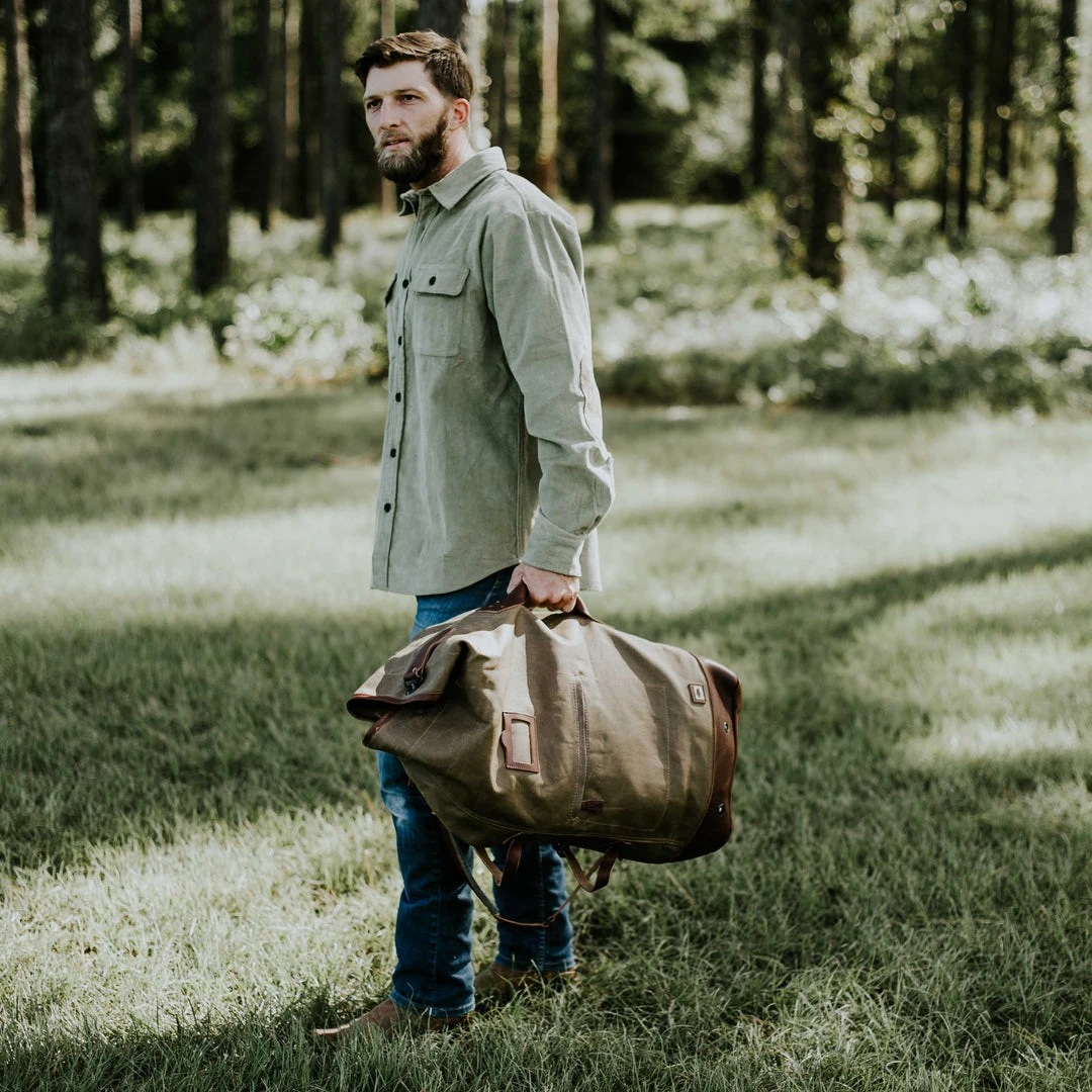 Buffalo Jackson Trading Co. Dakota Waxed Canvas Military Sea Bag Backpack | Field Khaki W/ Chestnut Brown Leather